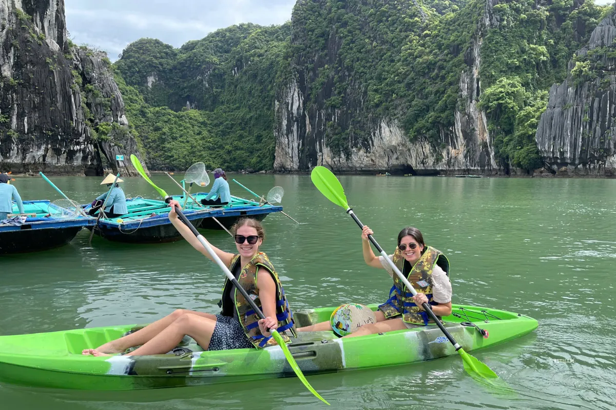 Kayaking experience in Halong Bay through calm waters and limestone cliffs