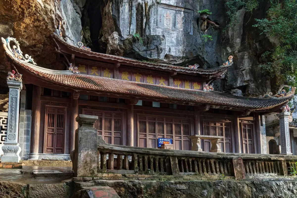 Best Tam Coc Day Tour | Explore Hoa Lu Citadel | Bich Dong Cave Pagoda Bich Dong cave pagoda bridge and entrance gate over lotus pond