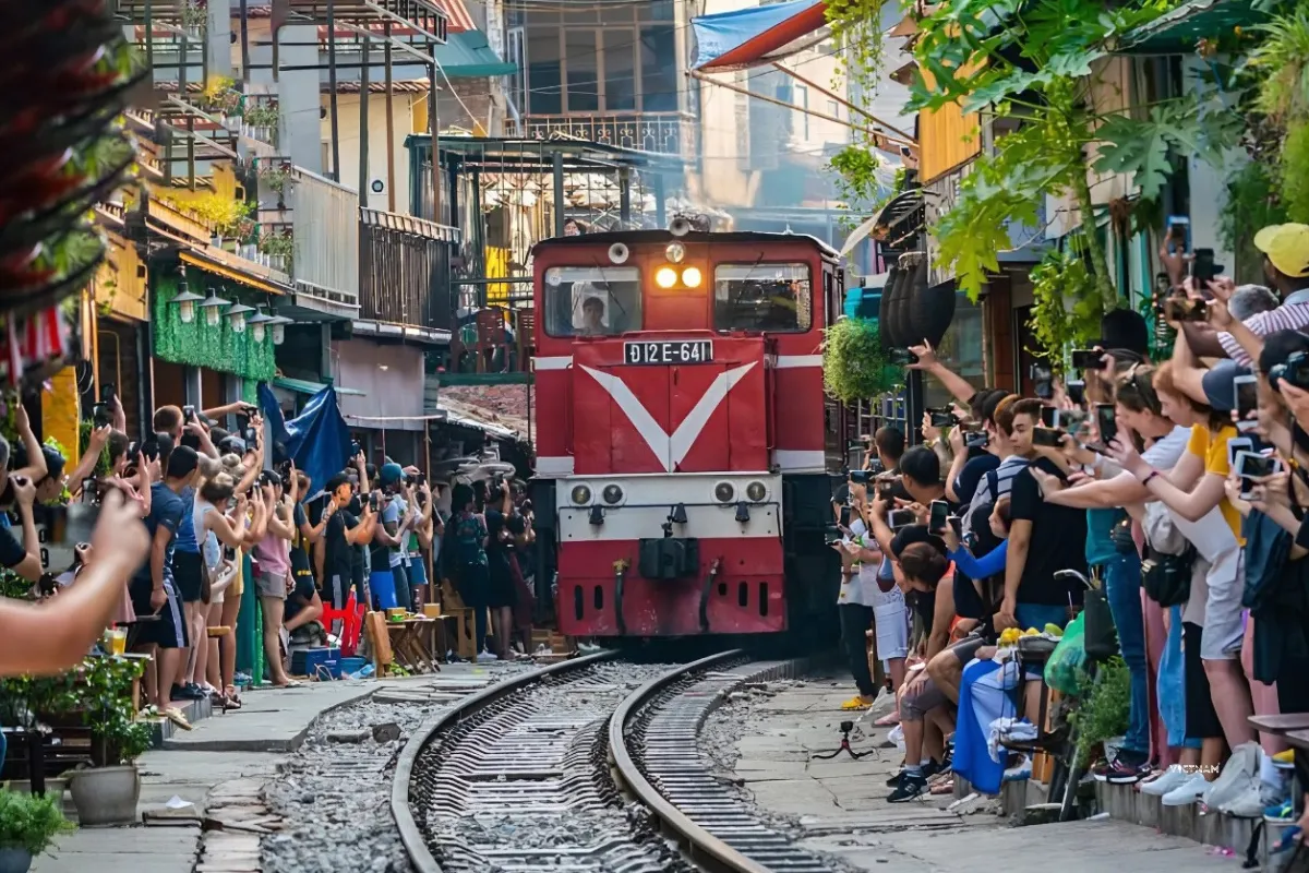 Hanoi train street narrow alley with passing train