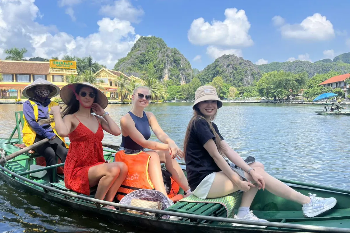 Tam Coc day tour boat ride through limestone mountains
