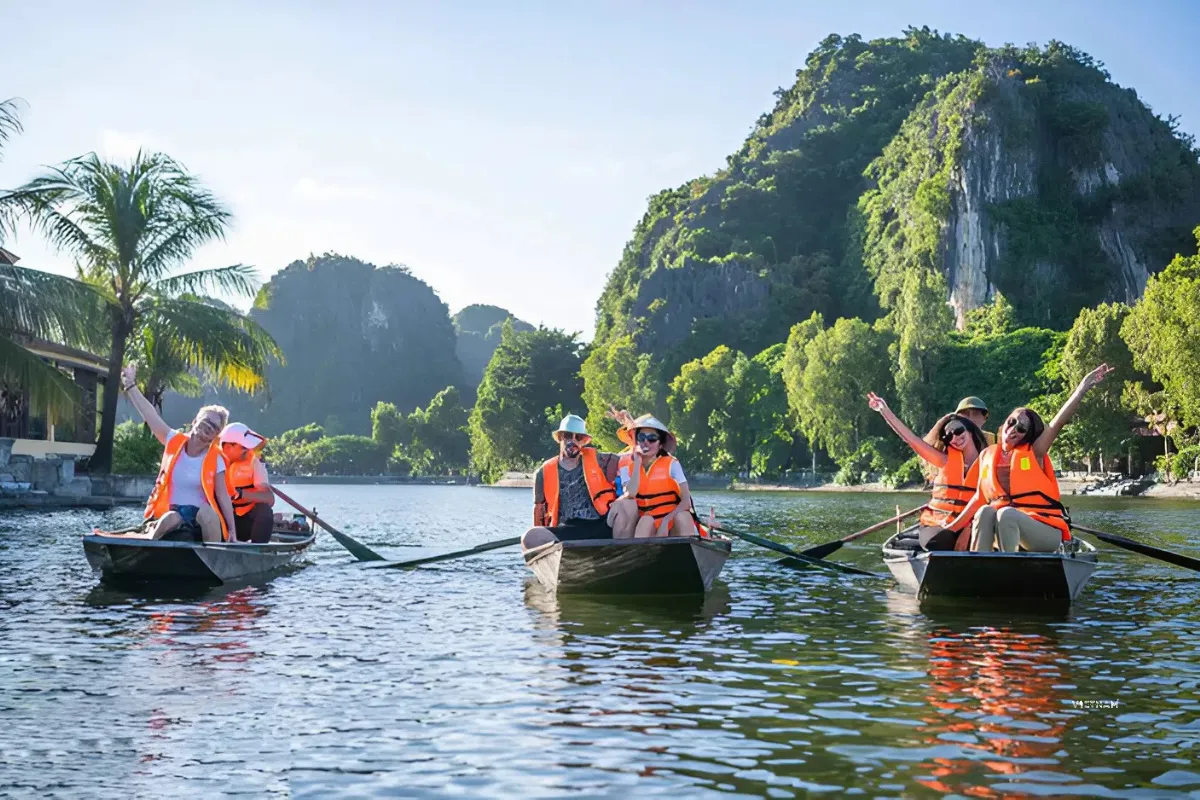 Tam Coc Private Tour | Hoa Lu Ancient Capital | Cycling to Bich Dong Tam Coc private boat tour entering limestone cave