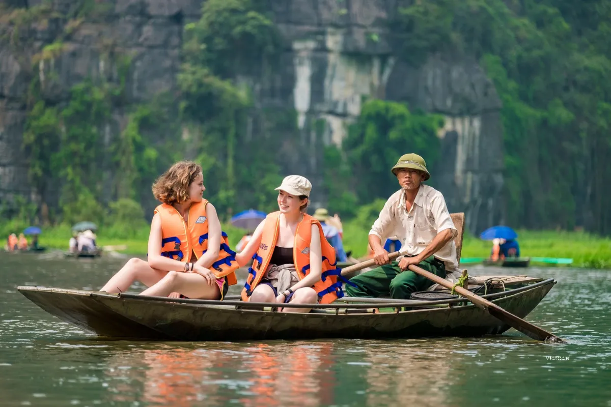 Tam Coc tour boat ride through limestone mountains and river