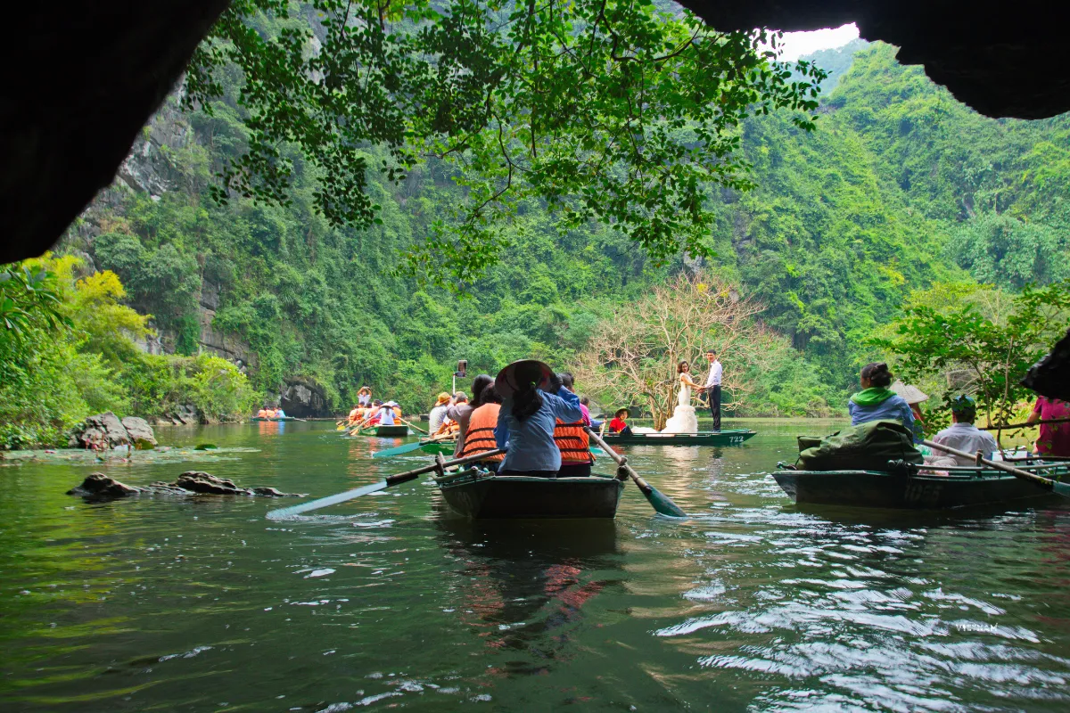 Trang An grottoes tour cave exploration by rowing boat