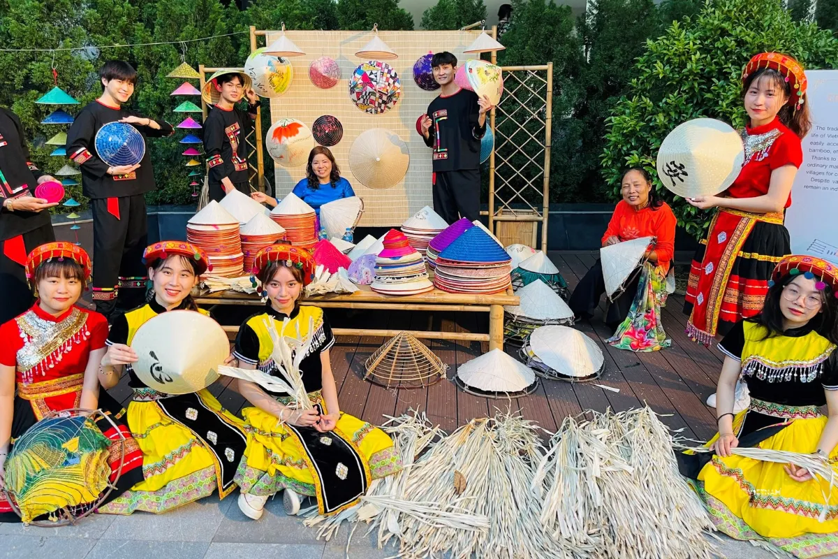 Exclusive Hanoi to Ninh Binh Day Tour: Incense Village & Trang An Boat Vietnamese women weaving traditional hat at village workshop