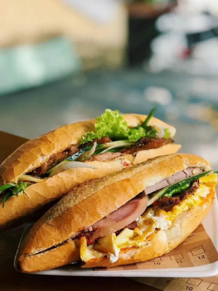 Traditional Hoi An cuisine with Banh mi and Cao Lau noodles and Vietnamese local dishes