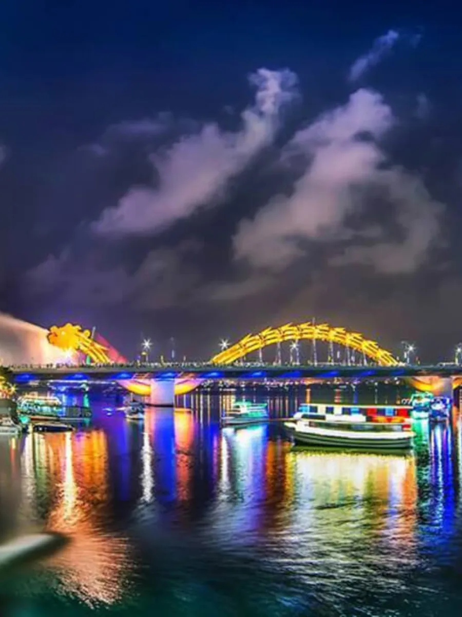 Dragon Bridge in Da Nang illuminated at night over Han River Vietnam