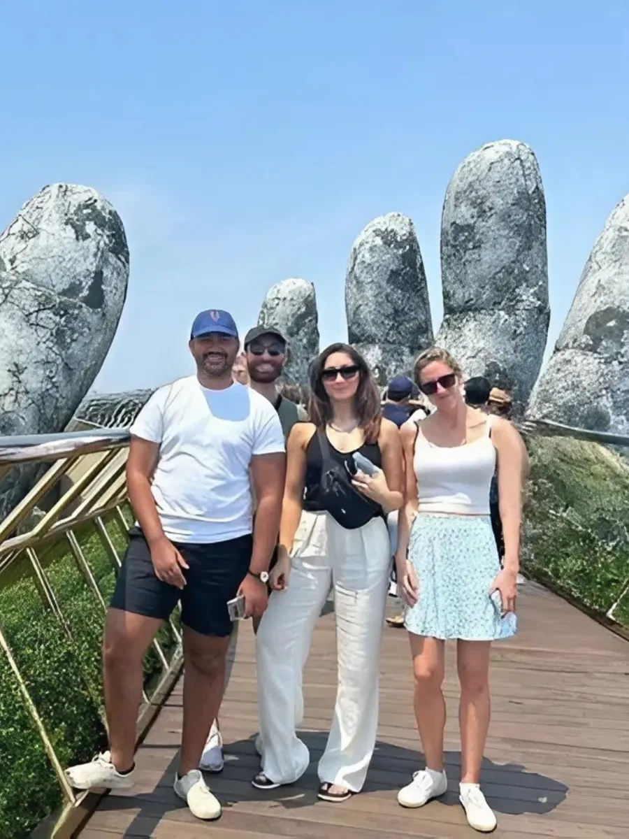 Golden Bridge at Ba Na Hills supported by giant stone hands in Da Nang Vietnam