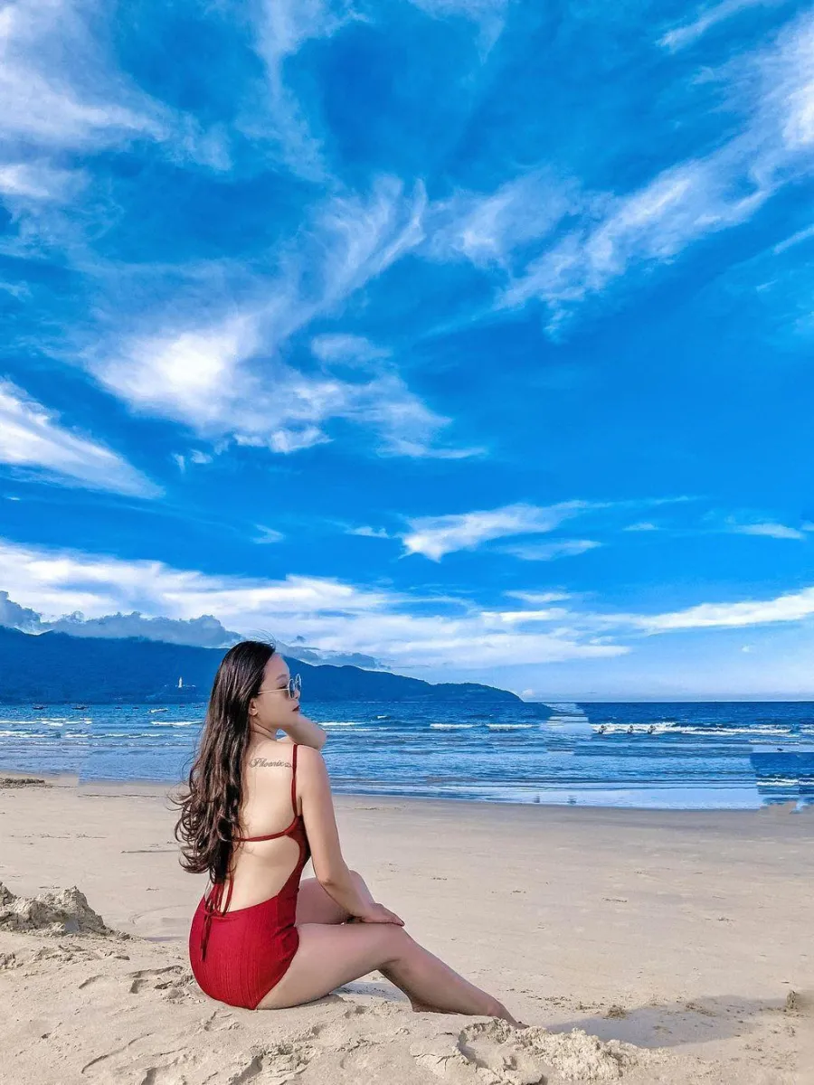 Tourists relaxing at My Khe Beach in Da Nang Vietnam during sunny weather