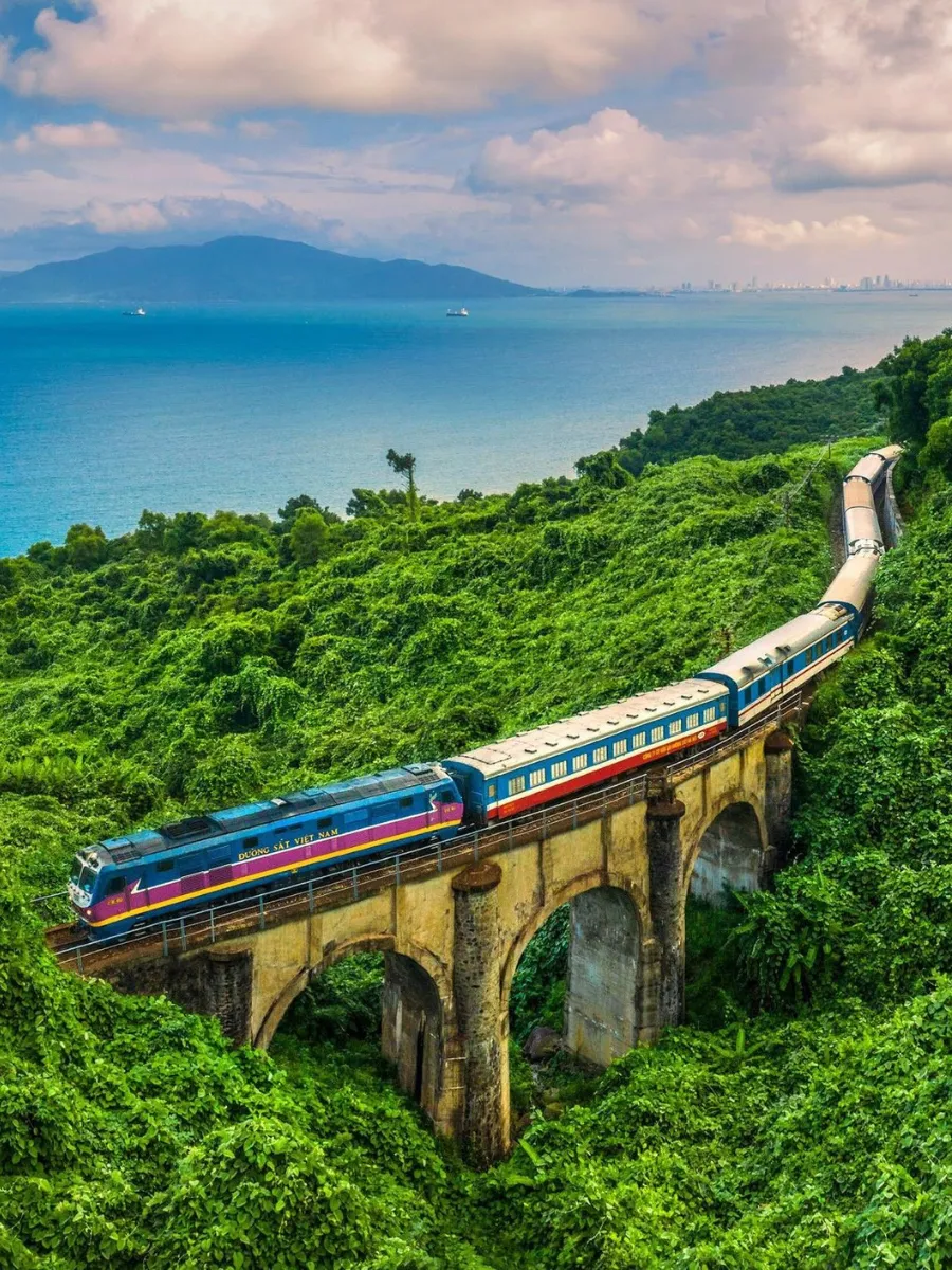Train traveling through Hai Van Pass on the route to Da Nang Vietnam